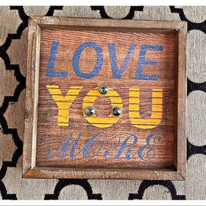 ‘Love You More’ sign decor with lights